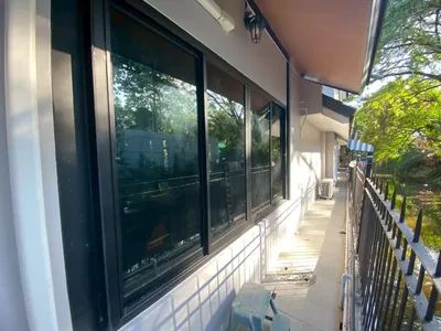 งานติดฟิล์มกรองแสงที่ หมู่บ้านเอื้อสุขถนนพัฒนาการ